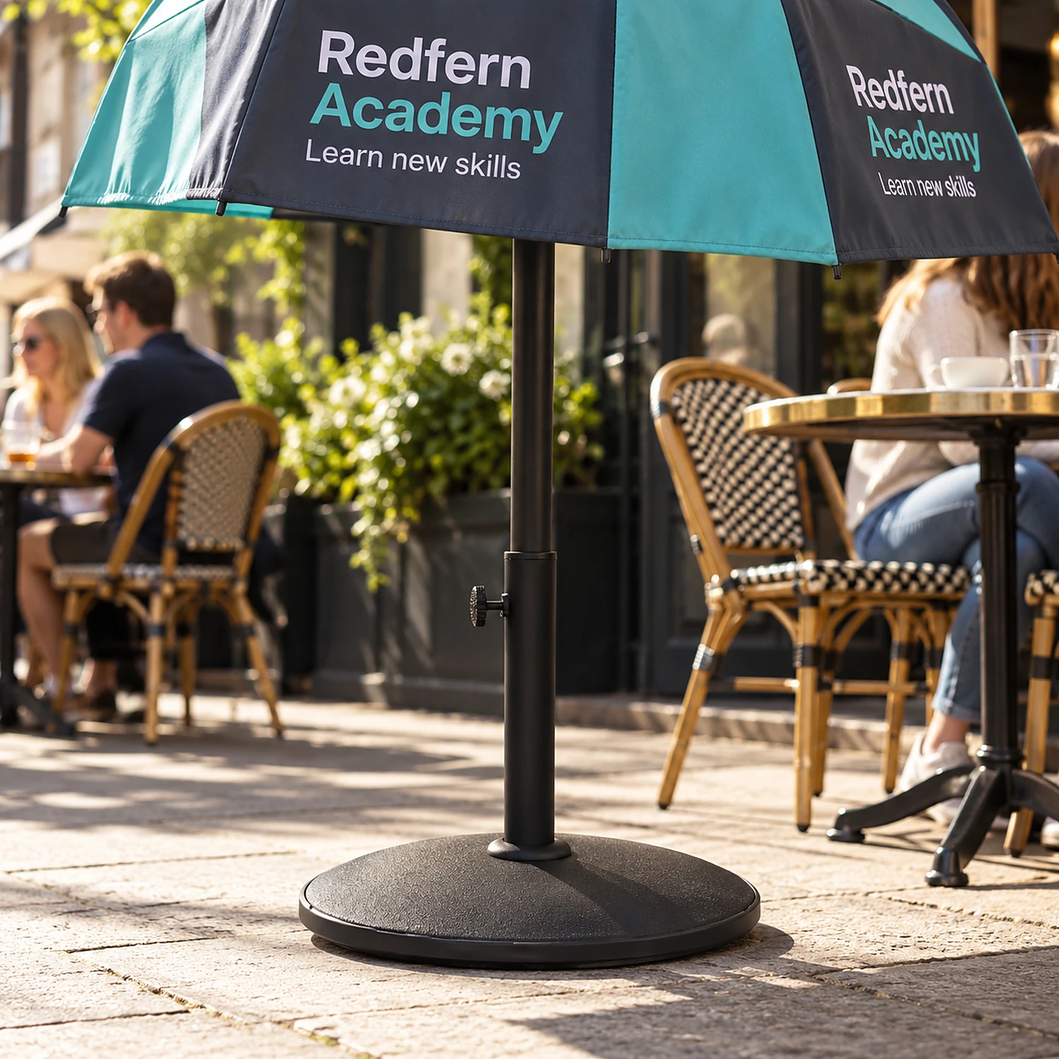 15kg parasol base holding a parasol on a cafe terrace