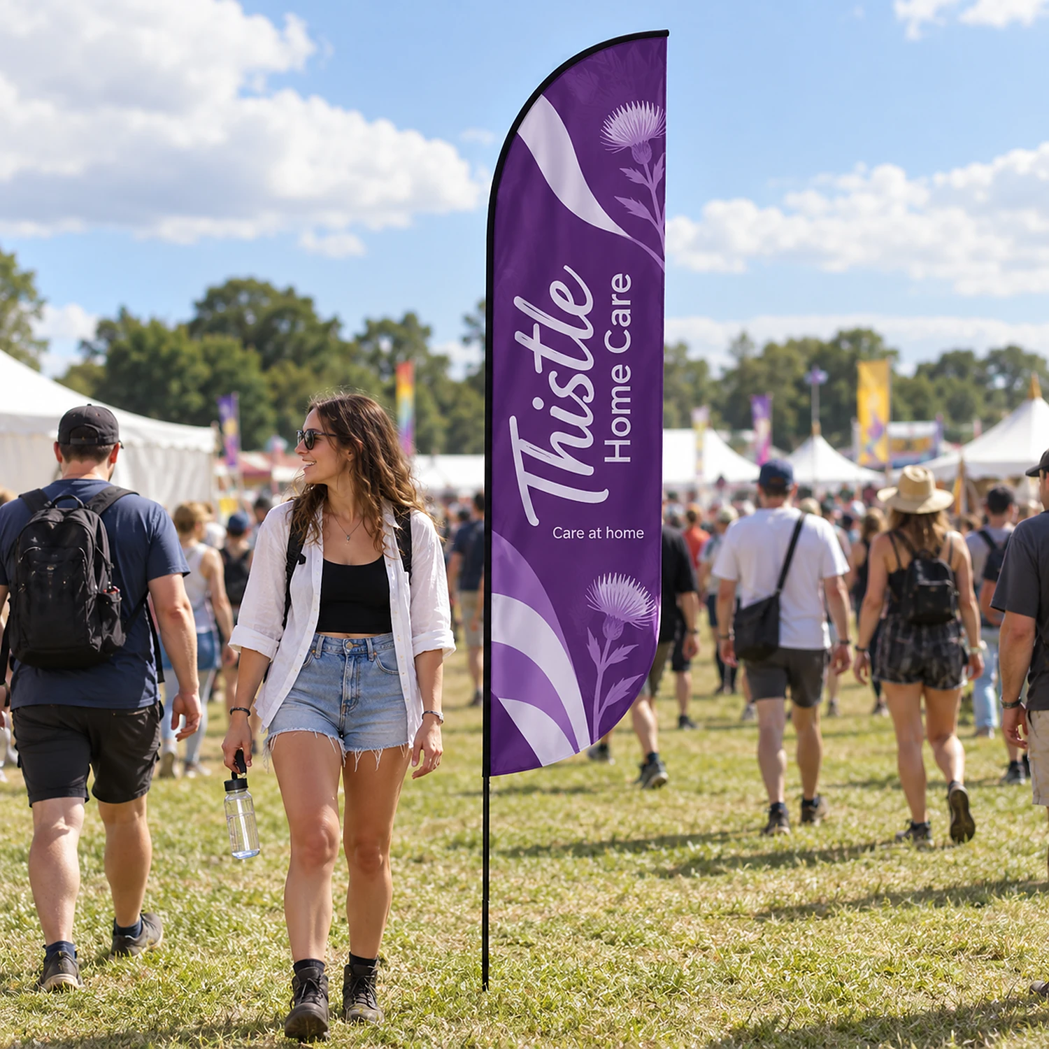 Bold fibreglass flag in use at a summer festival entrance