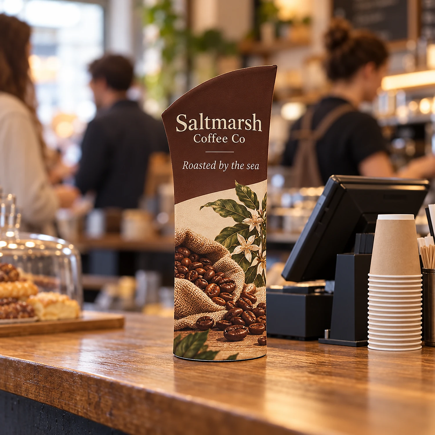 Brandcusi Bambino tabletop banner stand on a coffee shop counter