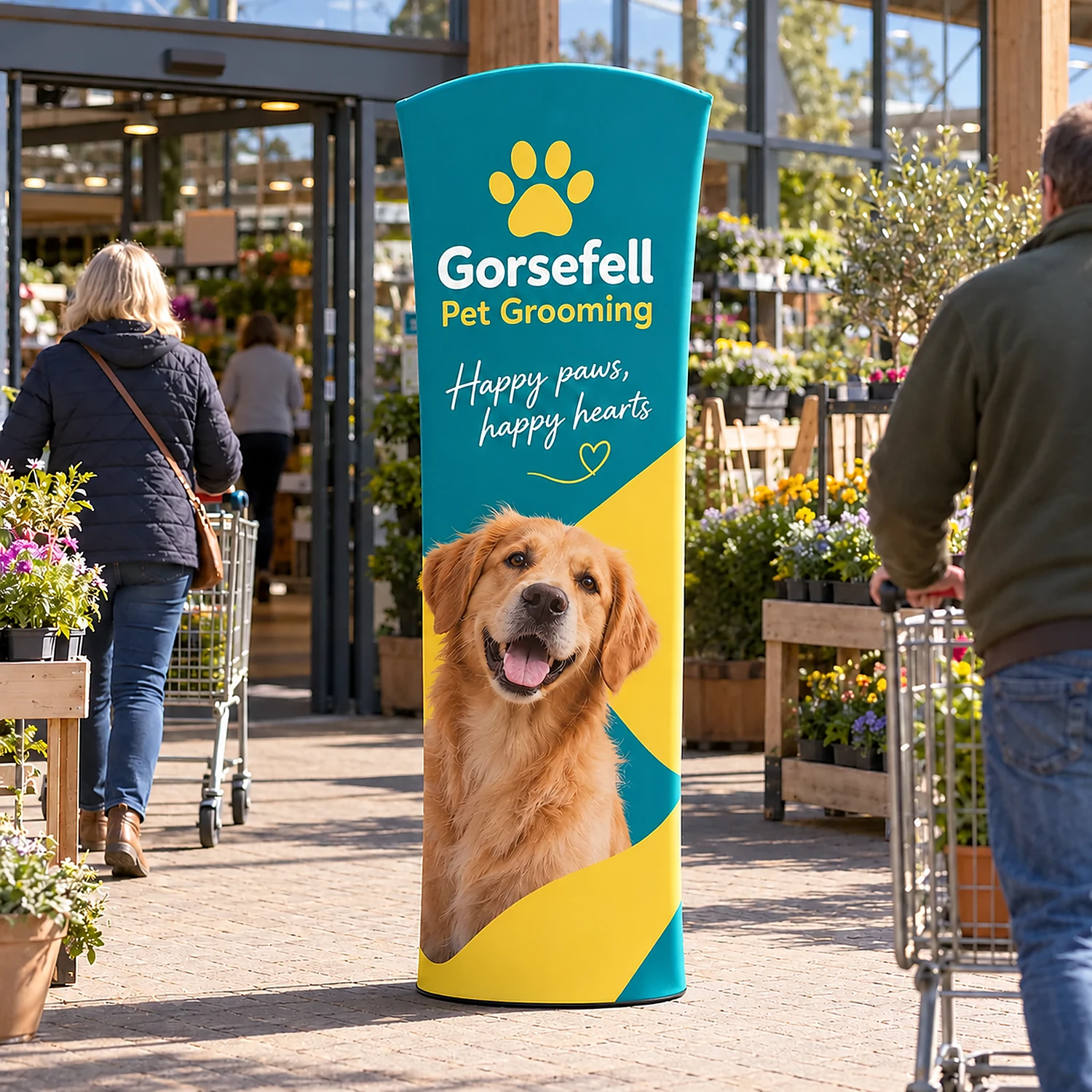 Brandcusi Outdoor Curved Banner Stand at a garden centre entrance, shown with an example design