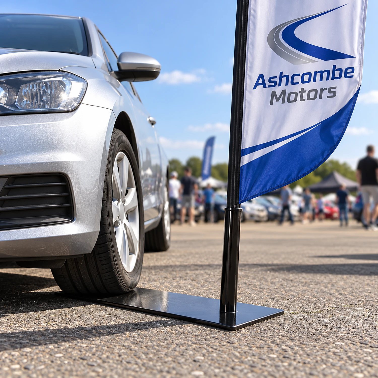 Car wheel flag base under a tyre at a car show