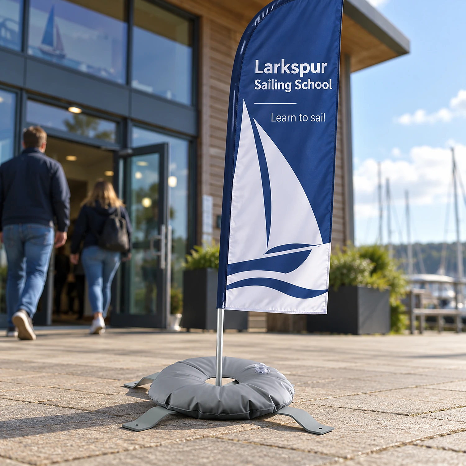 Cross base and weighting ring holding a flag on a business forecourt
