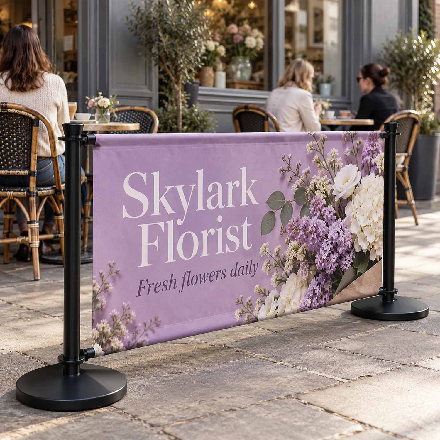 Extension cafe barrier kit with black posts around a cafe pavement terrace