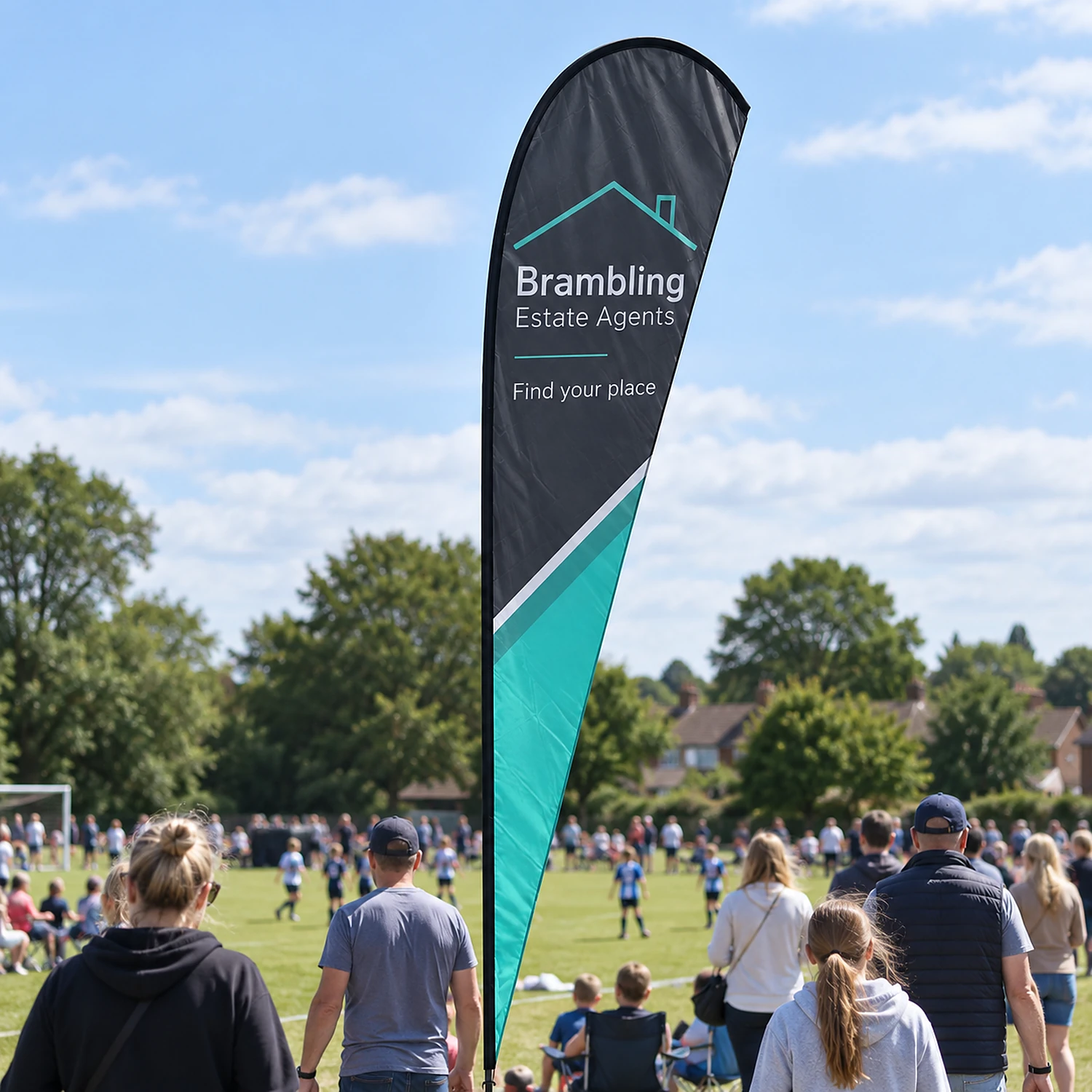 Feather Flag 14ft at a community sports day, shown with an example design