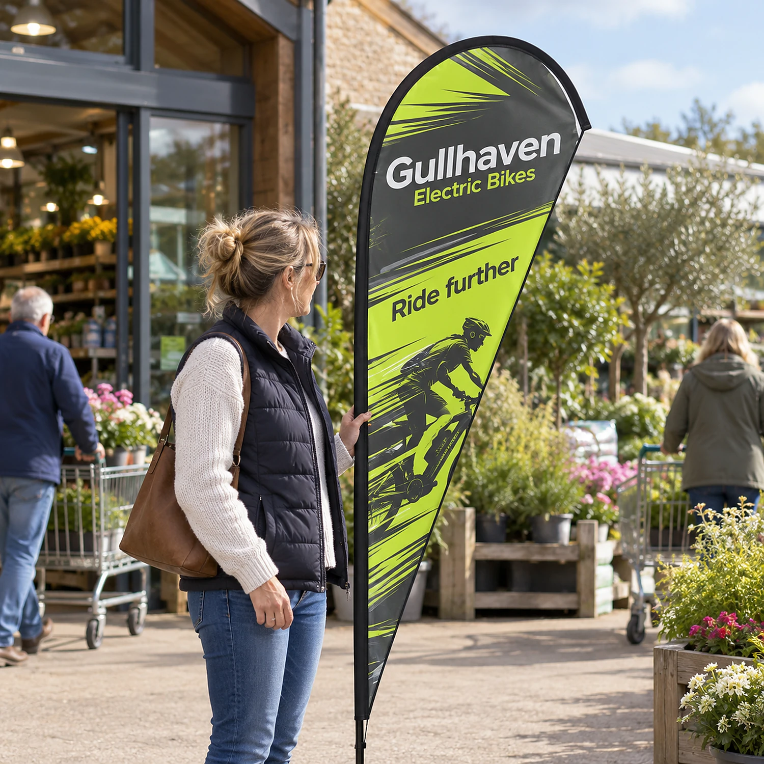 Feather Flag 7ft at a garden centre entrance, shown with an example design