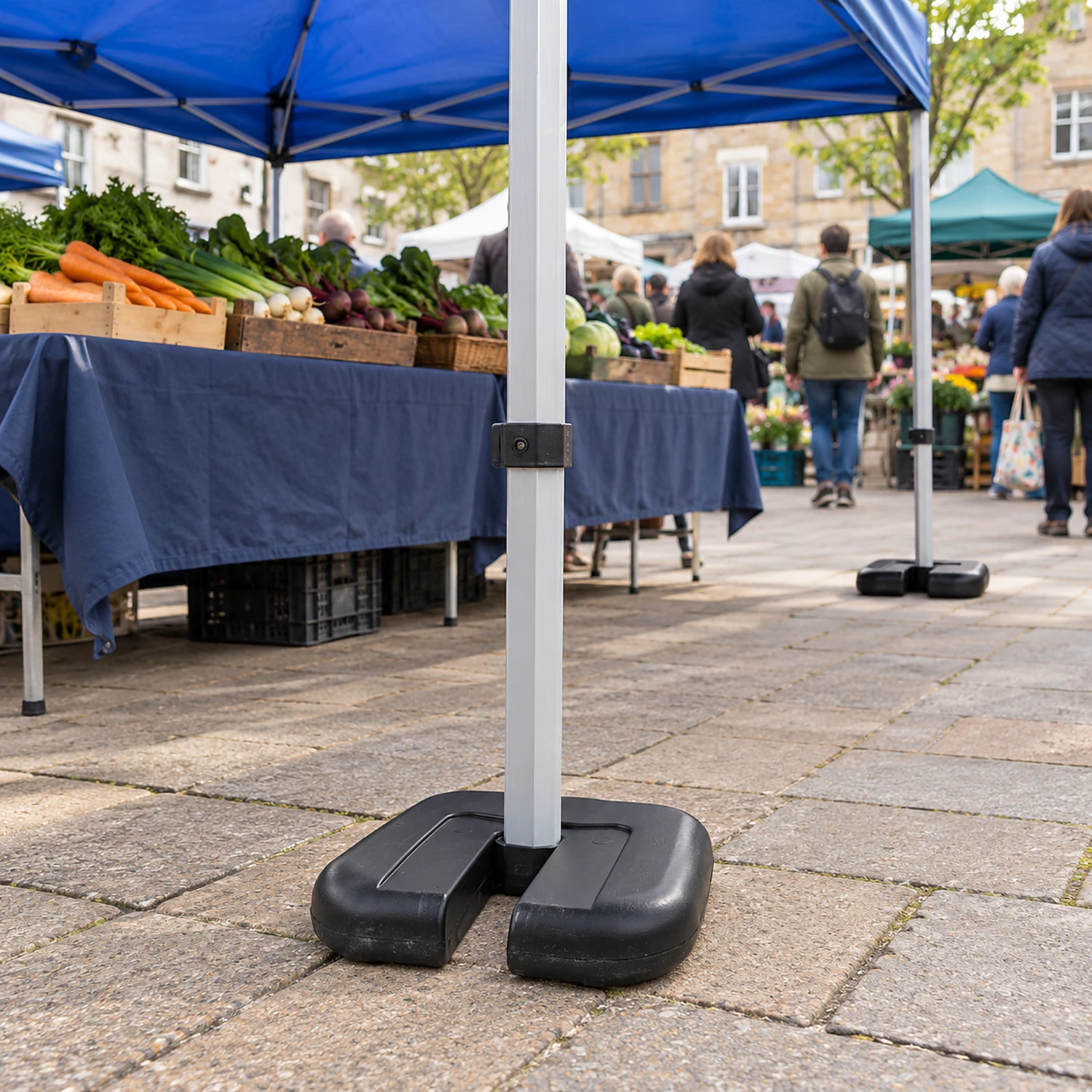 Gazebo leg weights in use at a street market