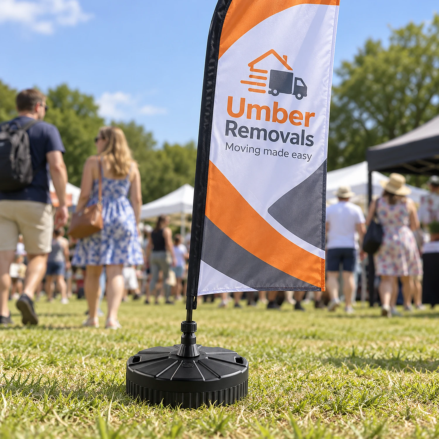 Large water sand base holding a flag at an outdoor event