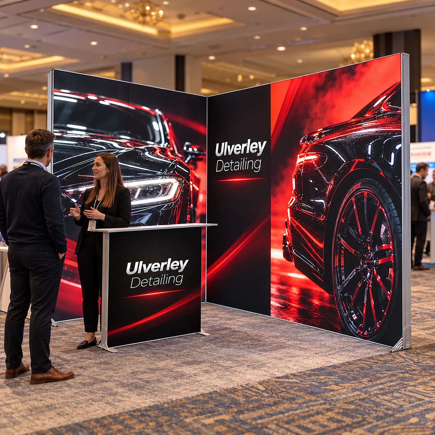 LED lightbox exhibition stand with counter at a business expo with staff talking to a visitor