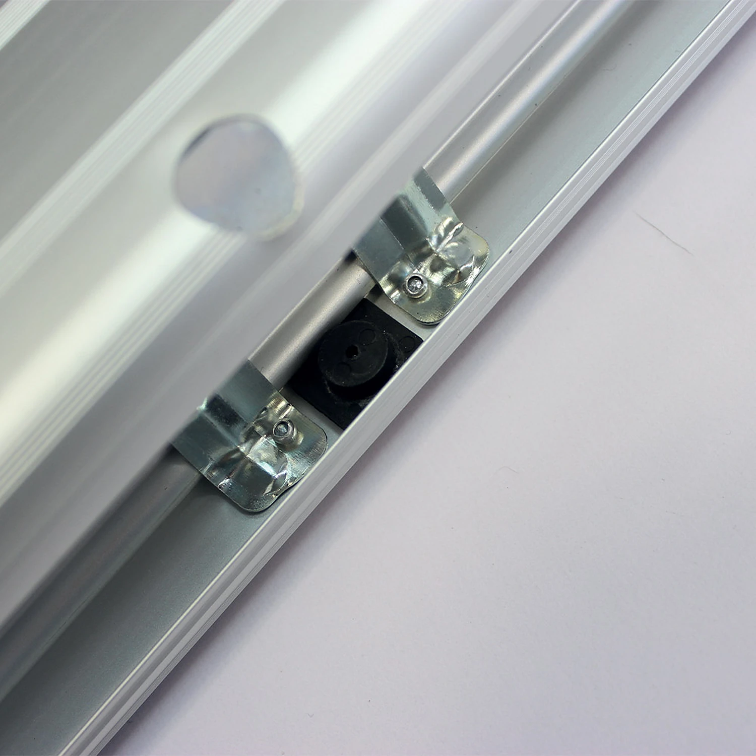 Roller banner cassette top slot and graphic clamp close-up