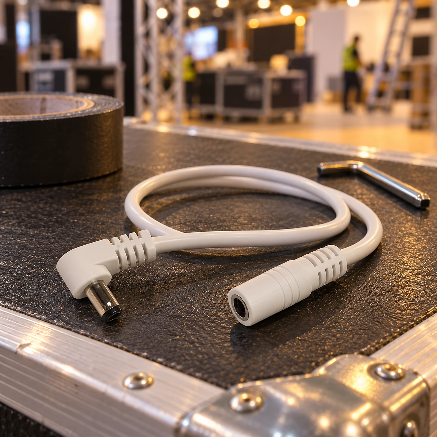 Power extension cable coiled on a flight case