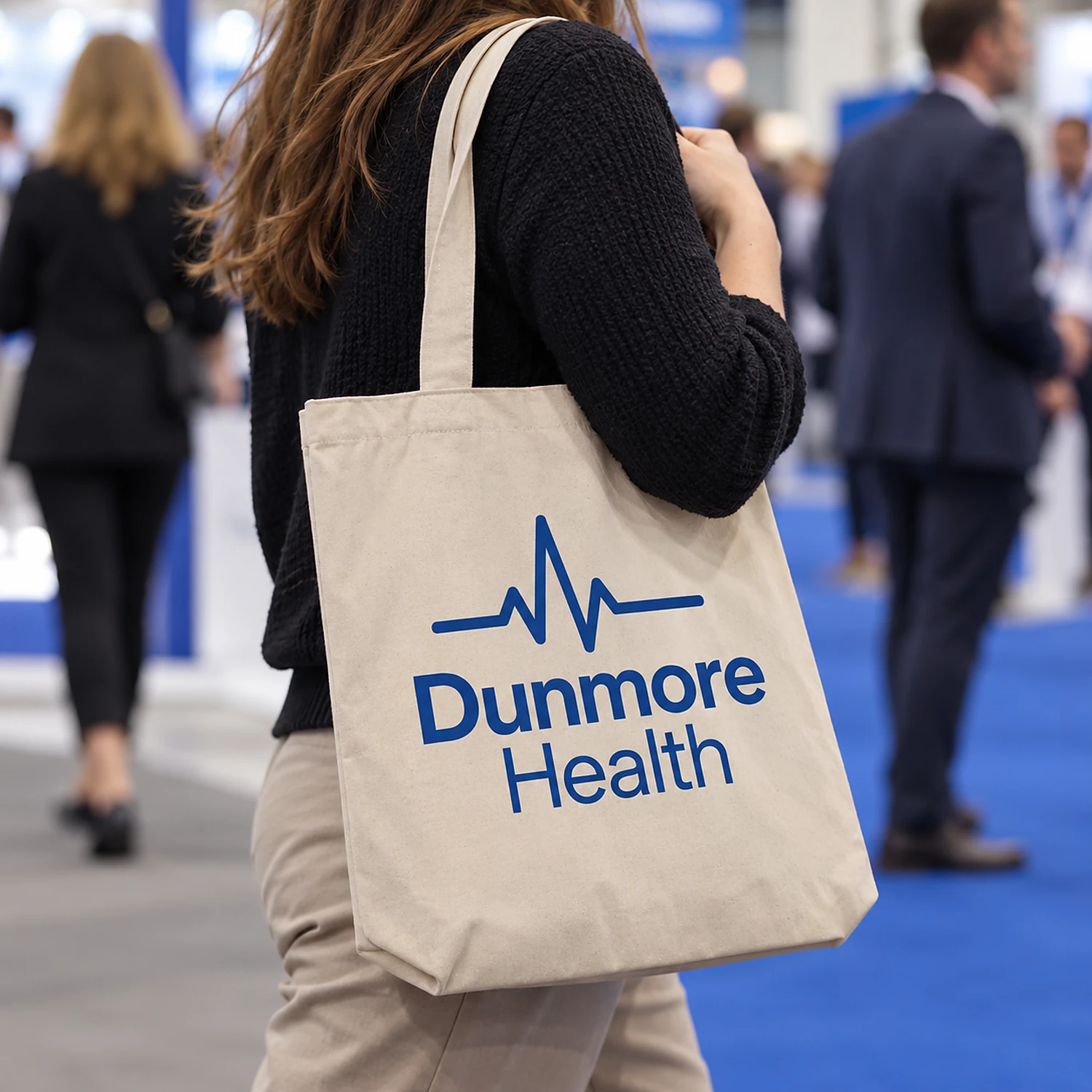 Printed cotton tote bag carried at a trade show
