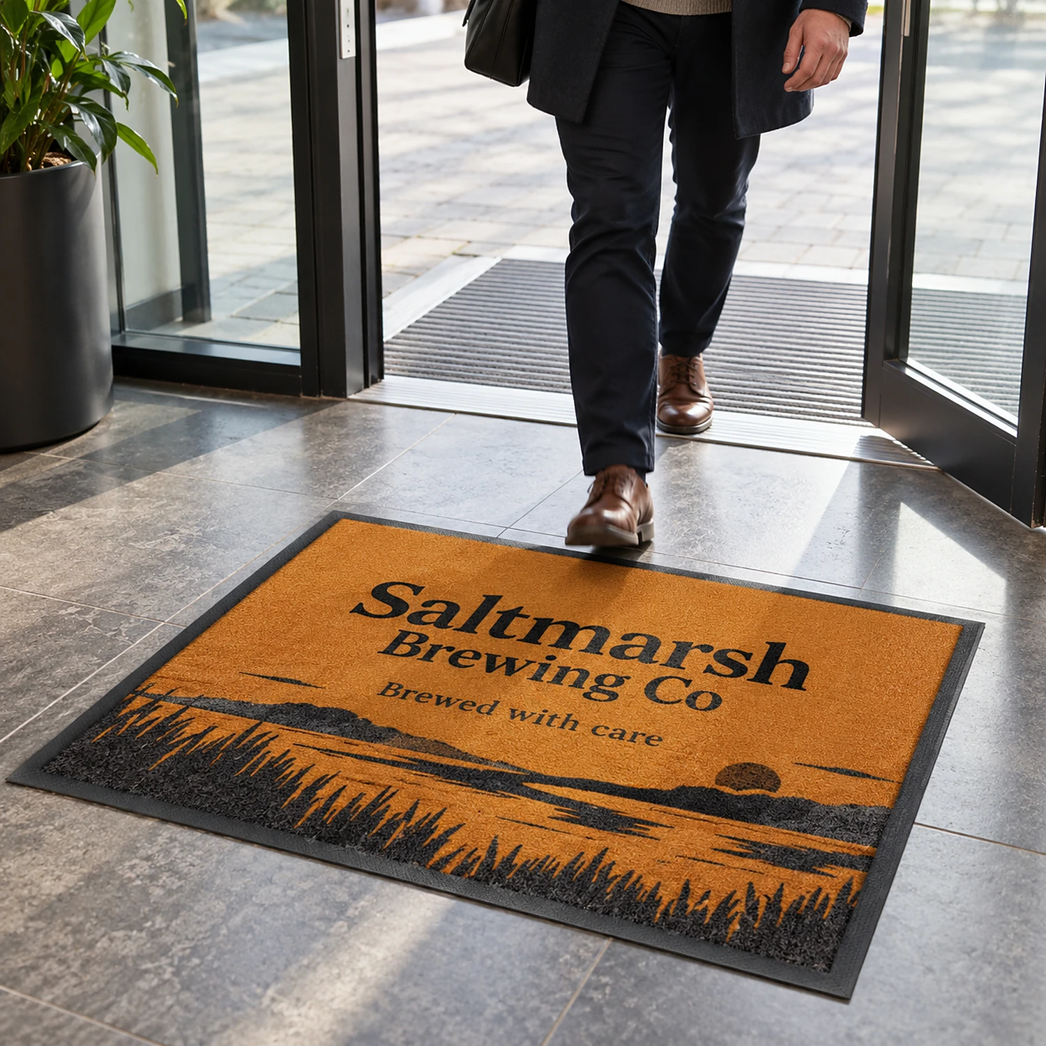 Printed floor mat at an office entrance