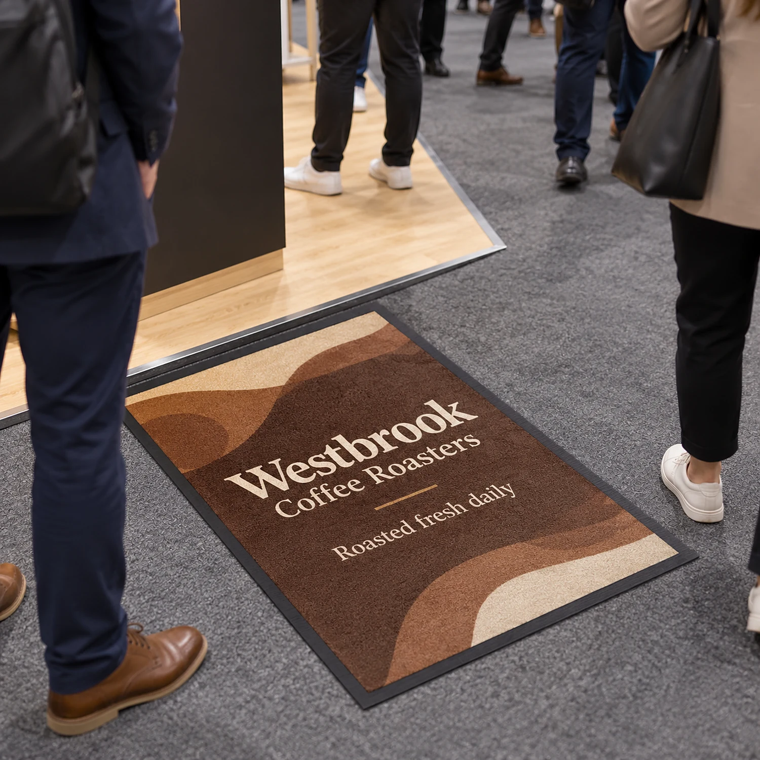 Printed floor mat in front of a trade show stand
