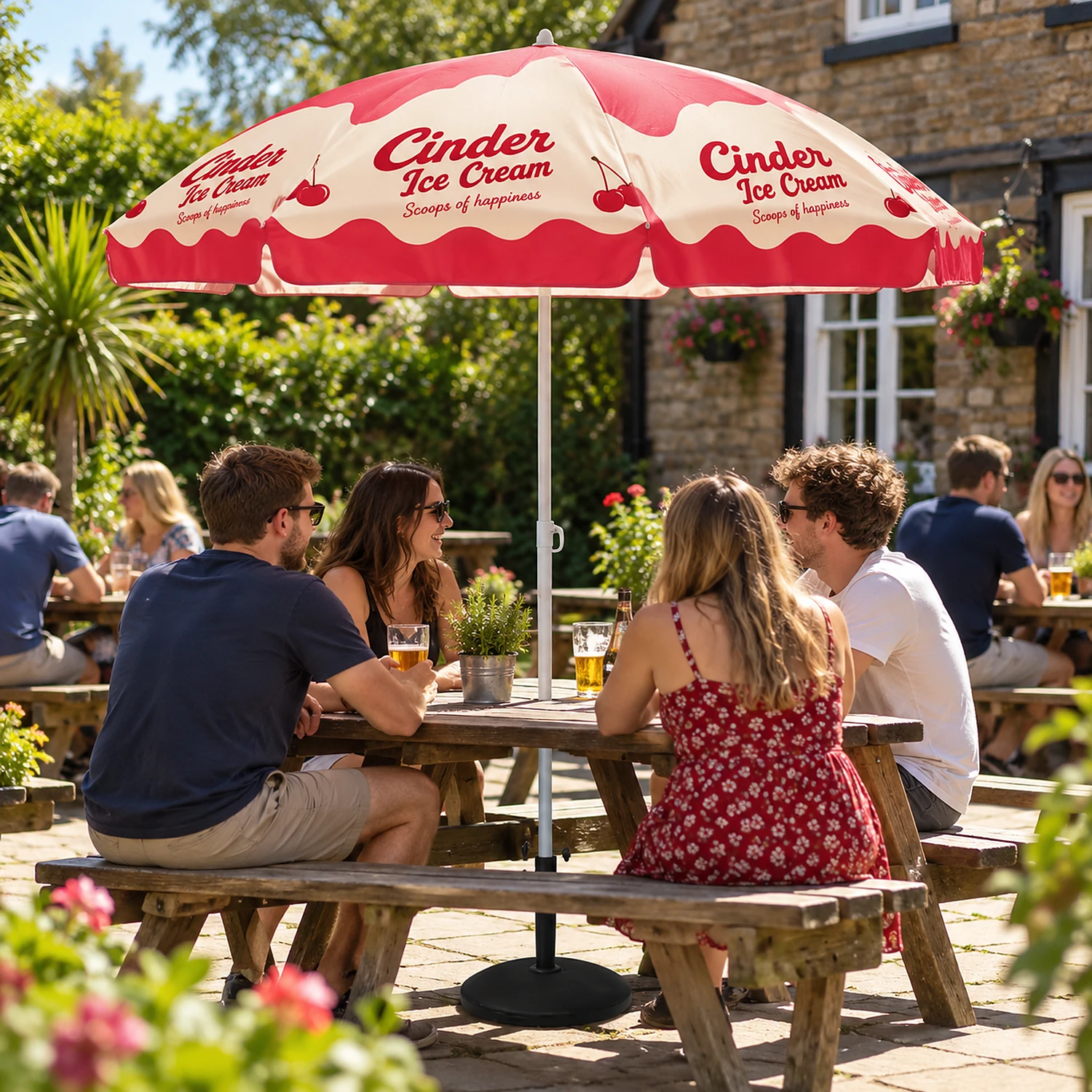 Printed promotional parasol in use in a pub beer garden