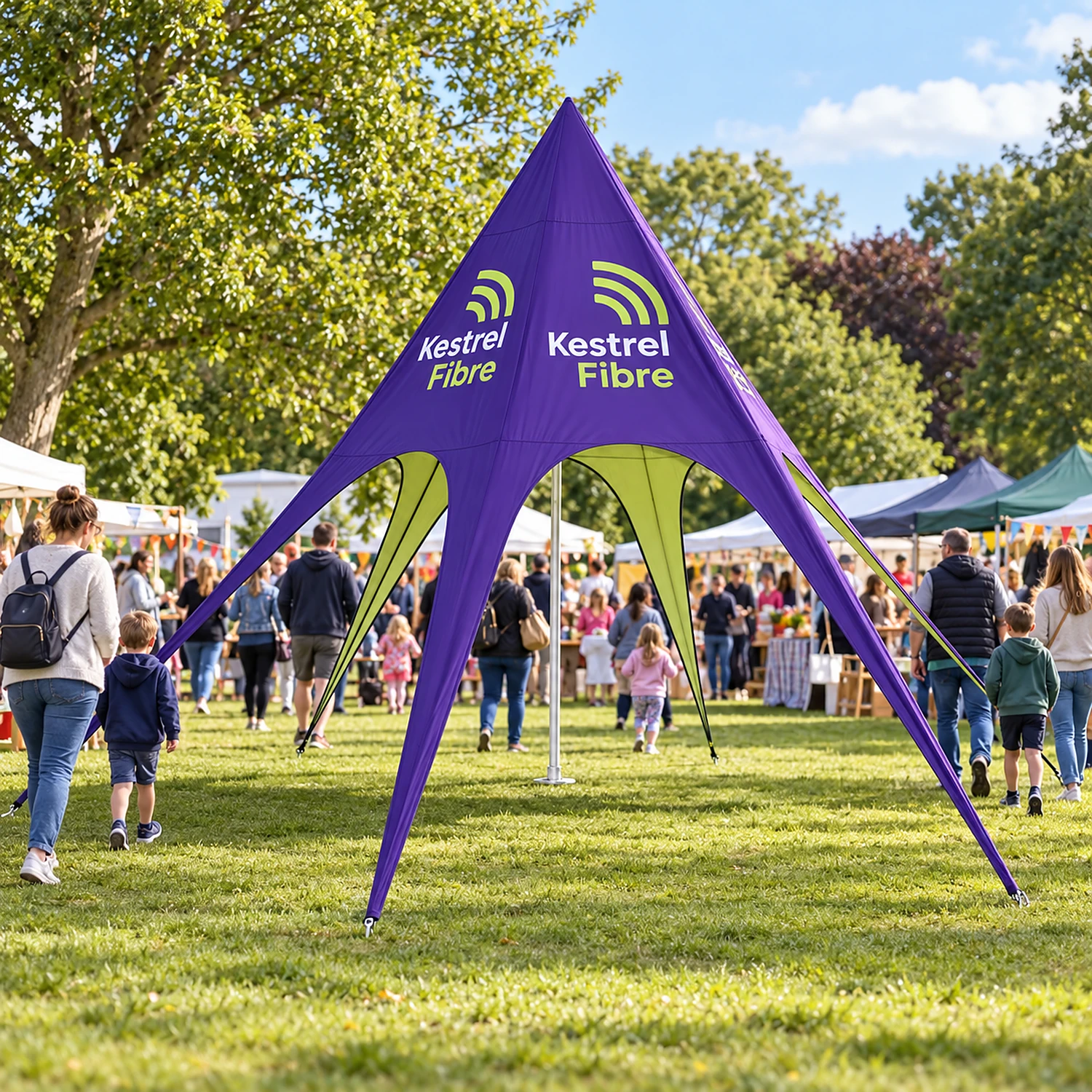 Printed star tent at a community event in a park