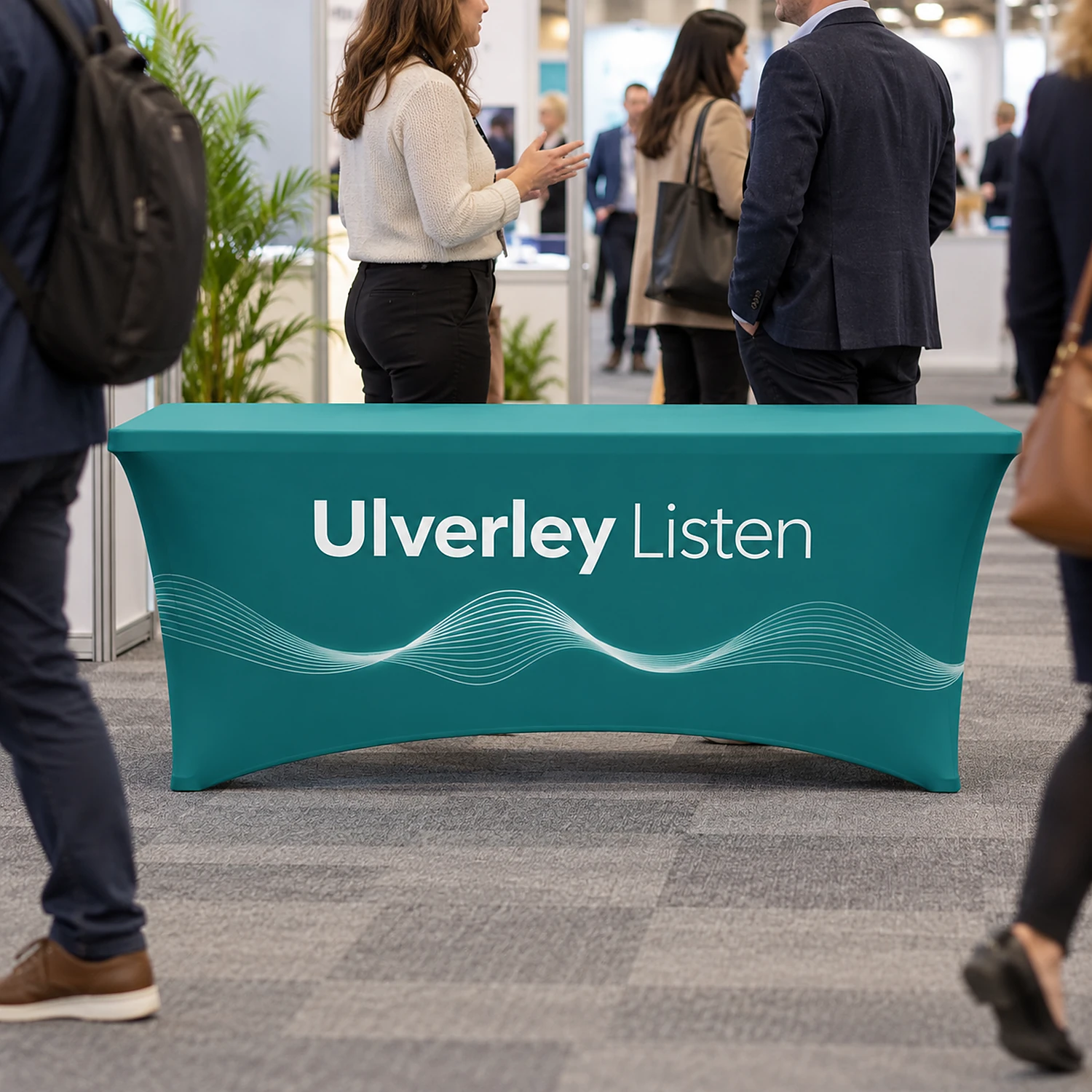 Printed stretch tablecloth in use at a busy trade show