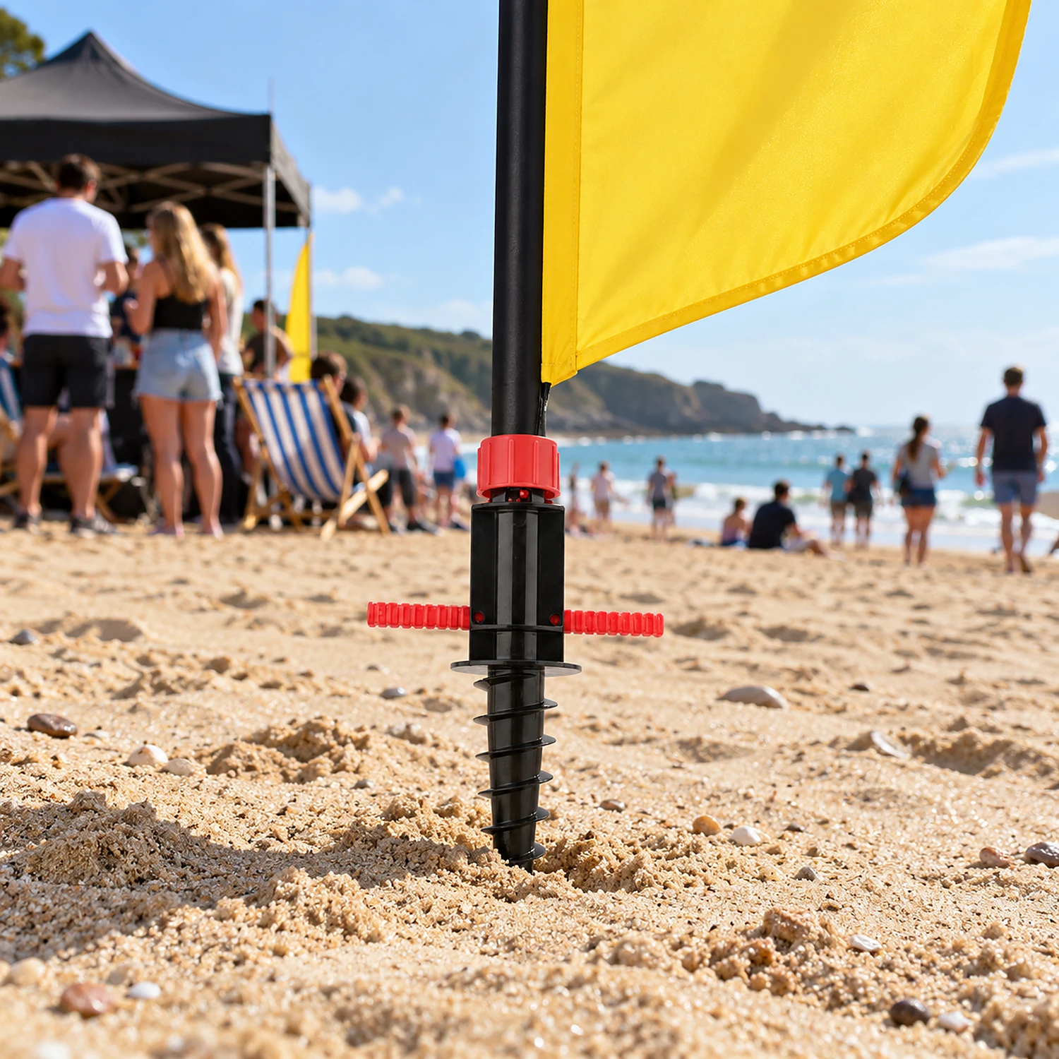 Screw spike flag base in use on a beach