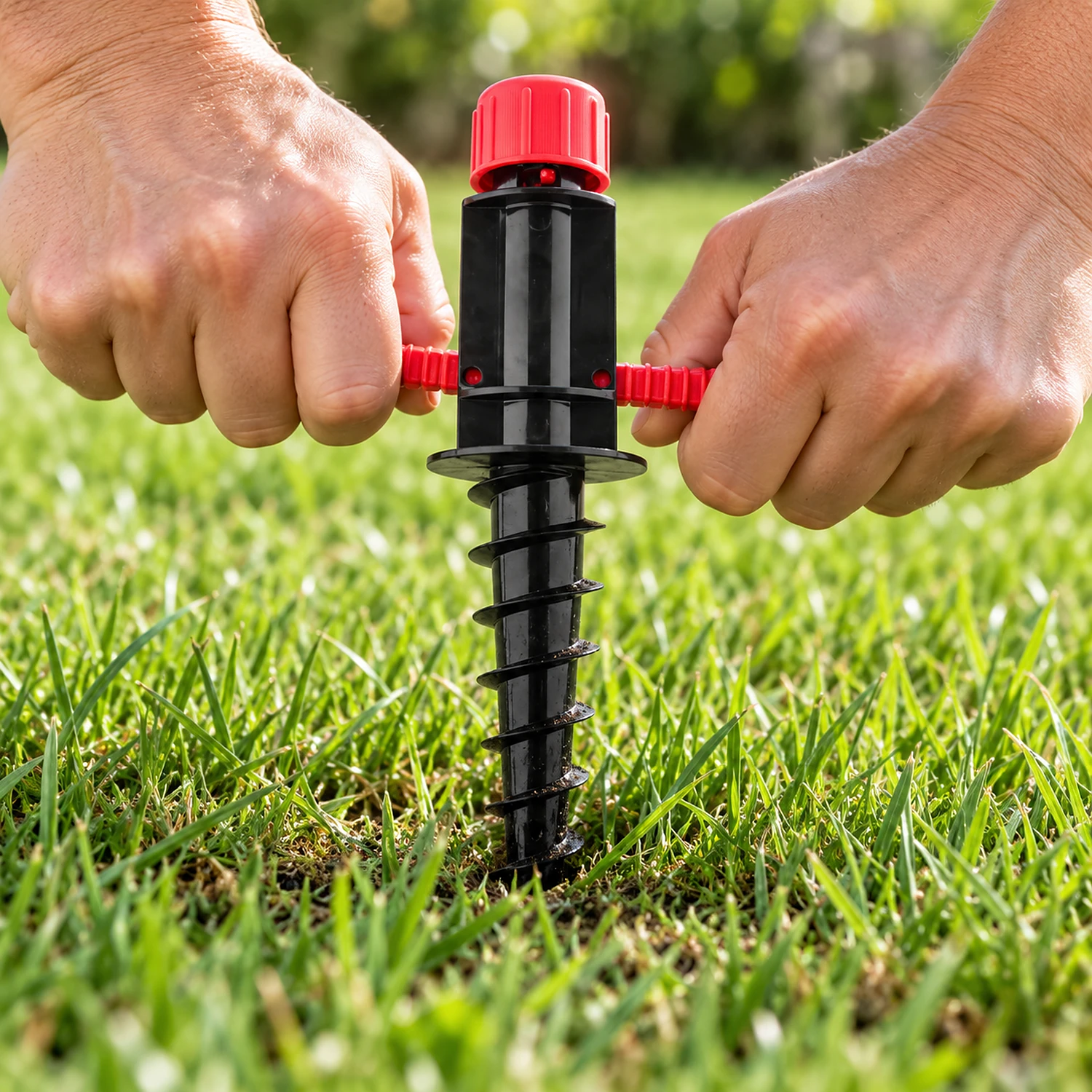 Screw spike being screwed into the ground by its handle