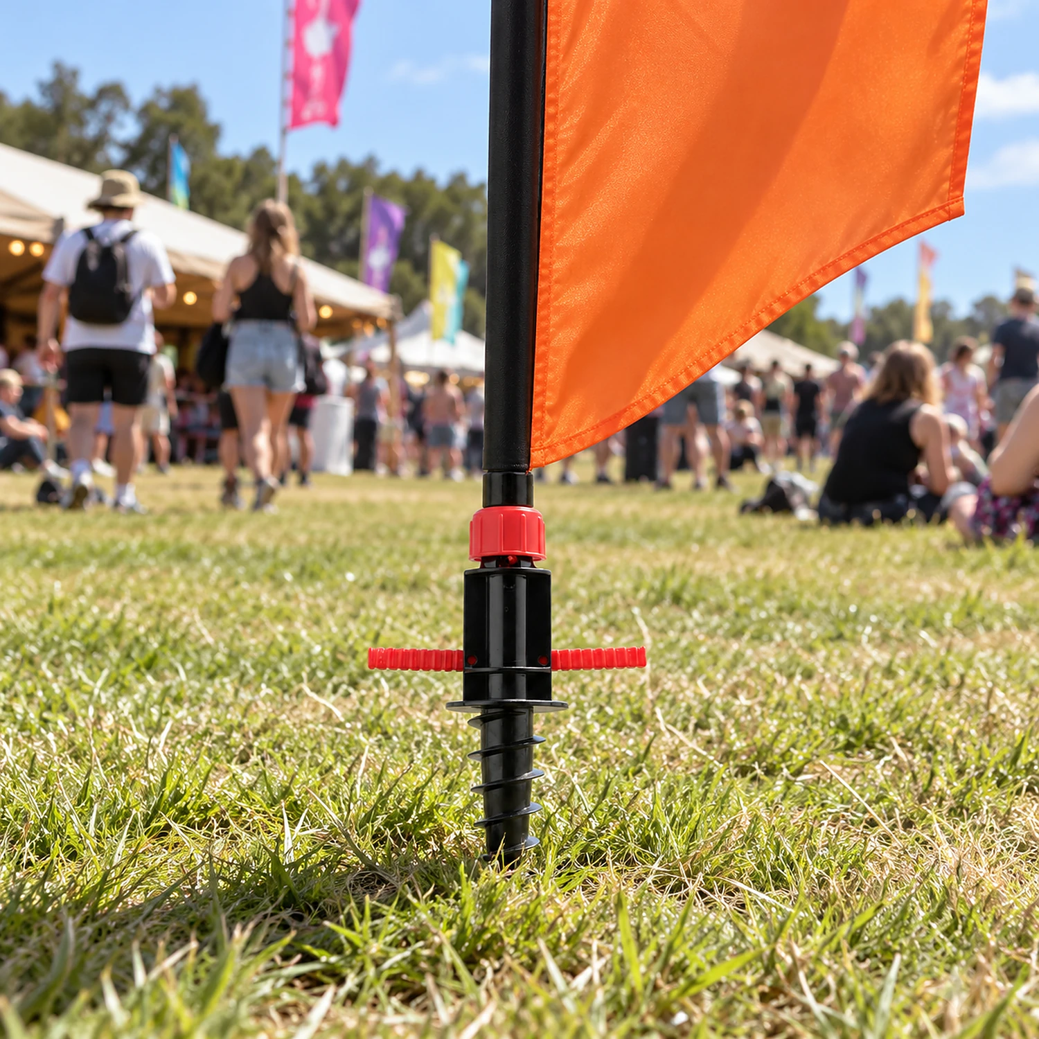 Screw spike flag base in use at a festival