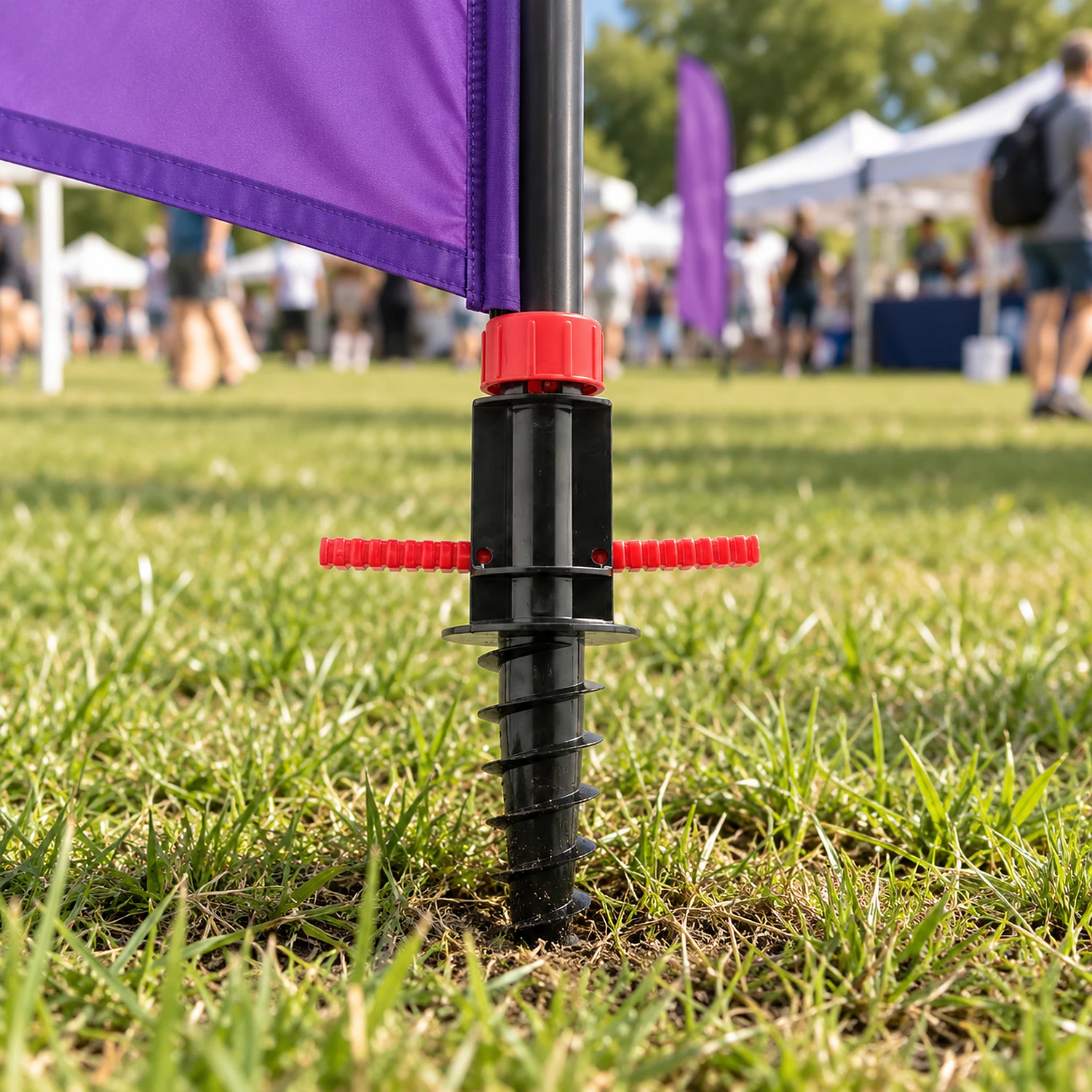 Screw spike flag base in use on grass