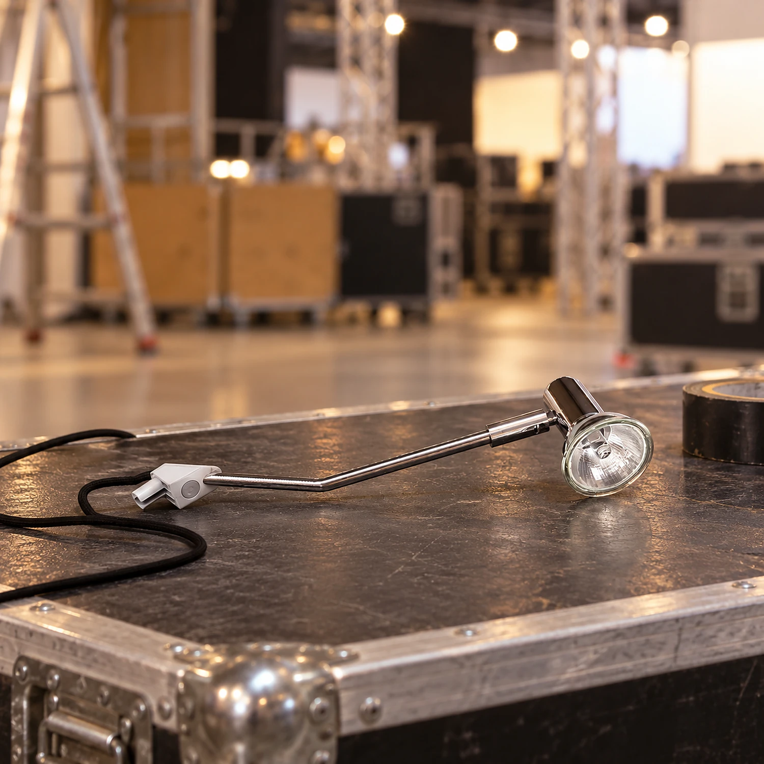 Spotlight on a flight case during stand build-up