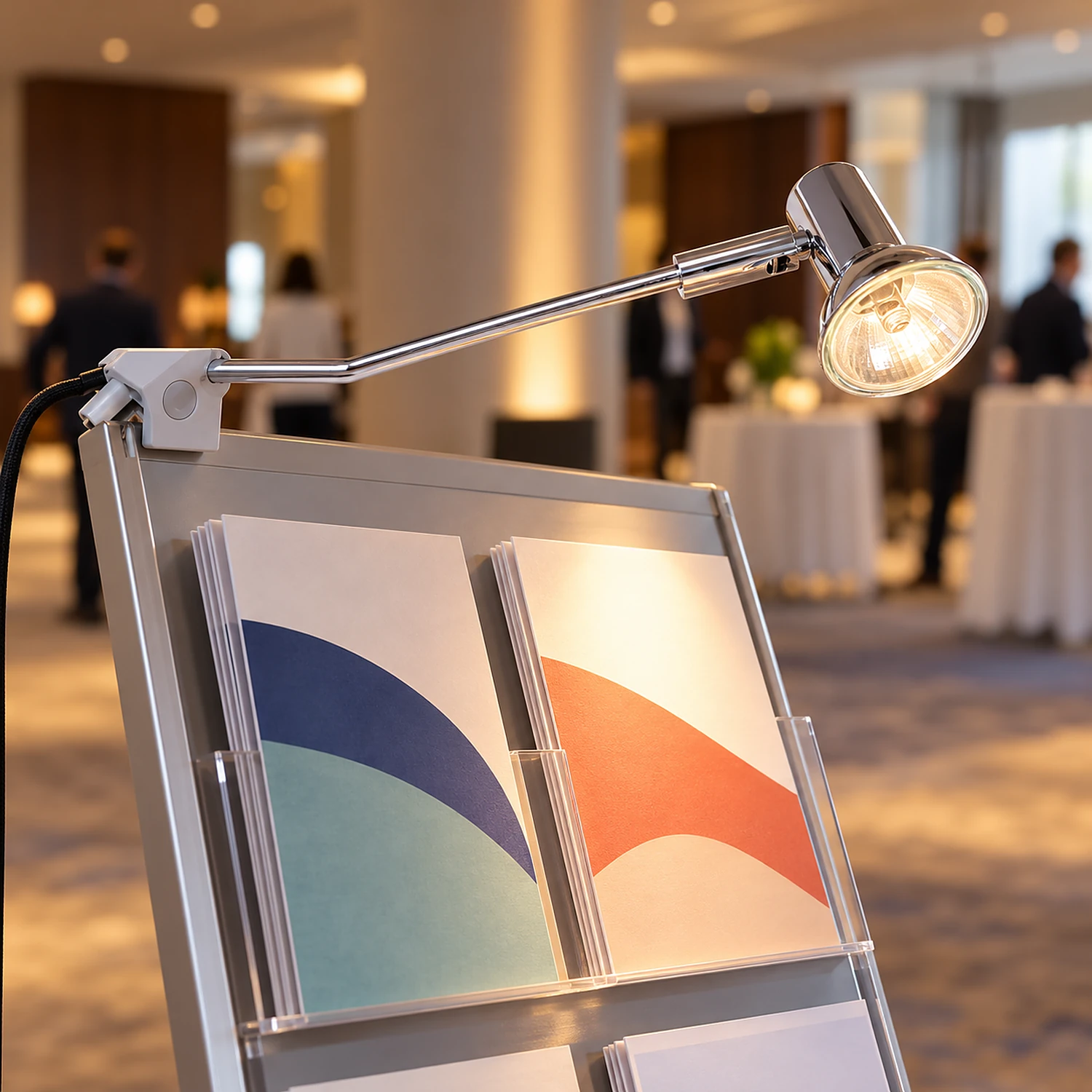 Spotlight lighting leaflets on a literature stand in a foyer