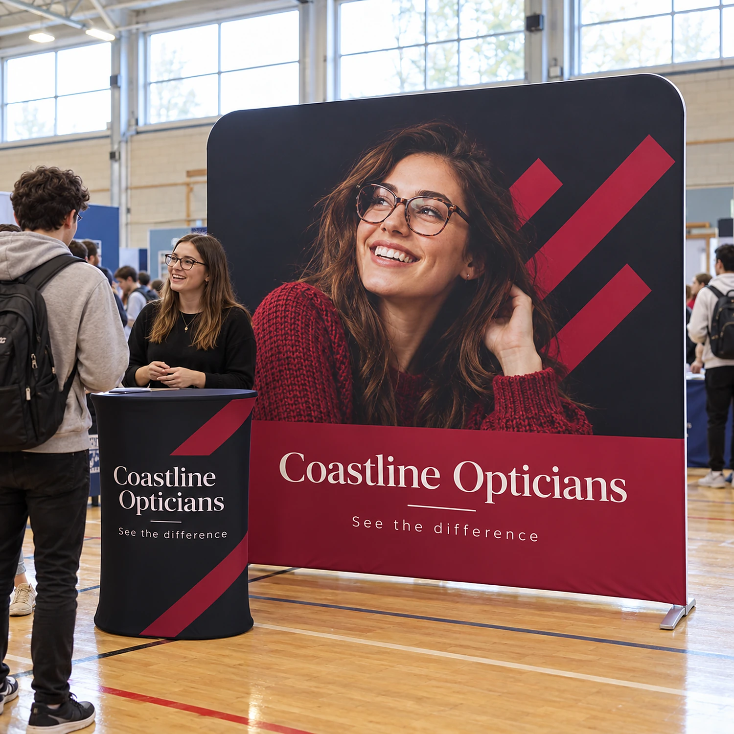 Straight 2.4m fabric display with oval counter in use at a university careers fair