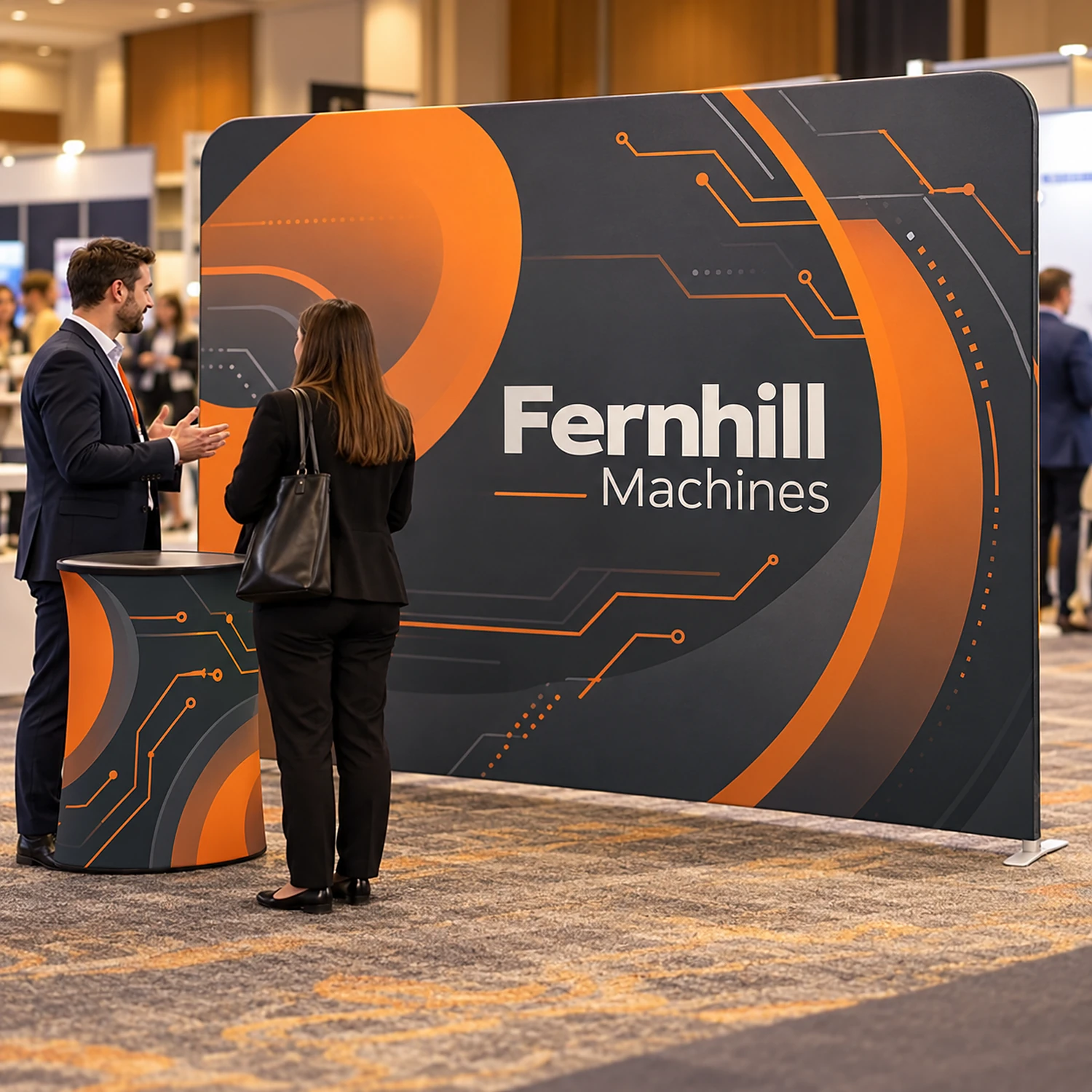 Straight fabric display wall with counter at a business expo with staff talking to a visitor