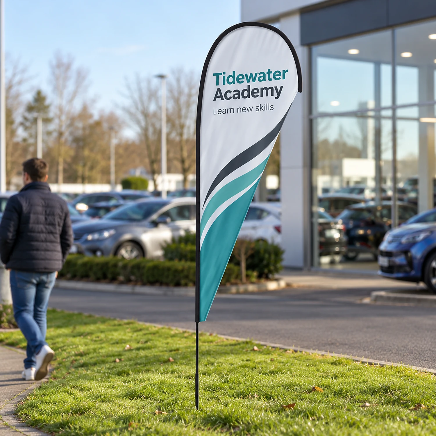 Teardrop fibreglass flag in use outside a car showroom