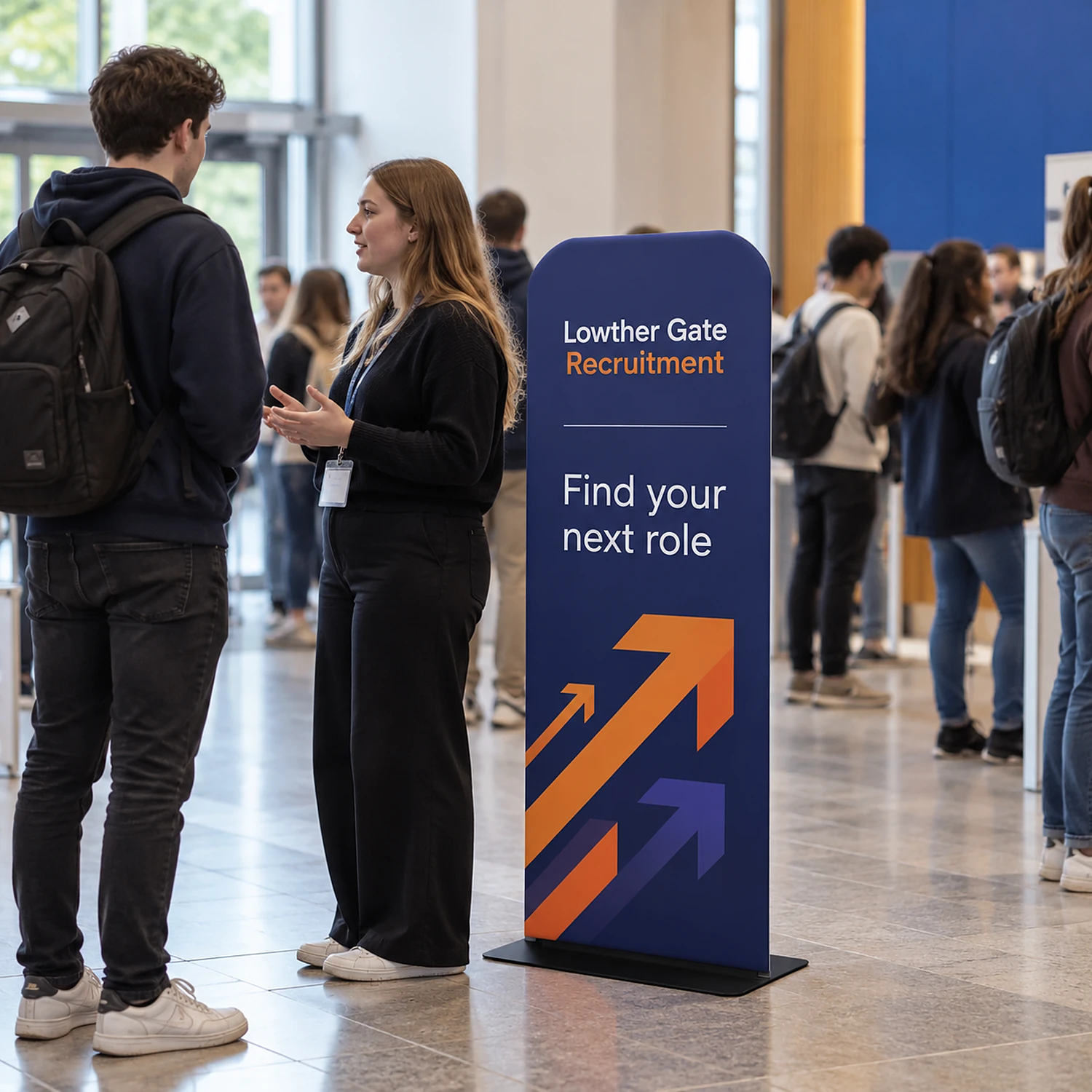 600mm x 1524mm rounded-corner tension banner stand in use, shown with an example design