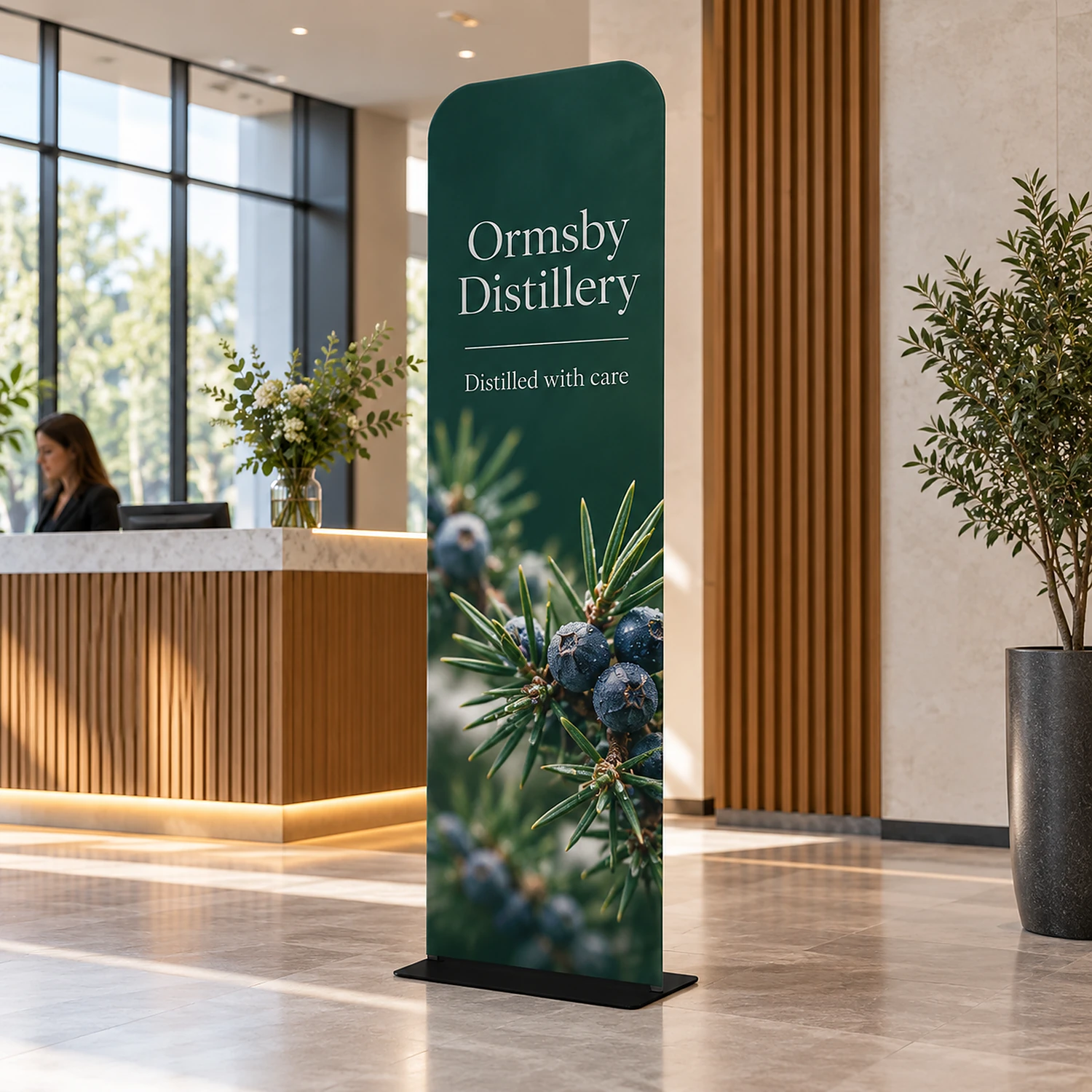 600mm x 2260mm rounded-corner tension banner stand in use, shown with an example design
