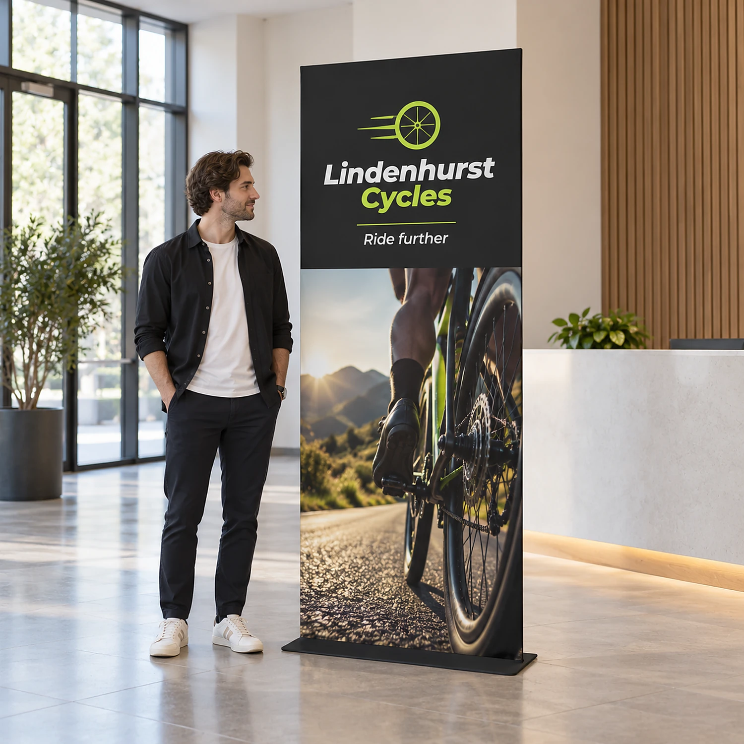 913mm x 2260mm square-corner tension banner stand in use, shown with an example design