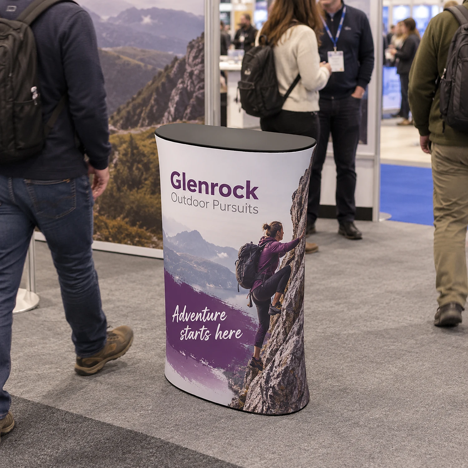 WaveLine Counter ML fabric display counter at a trade show, shown with an example design