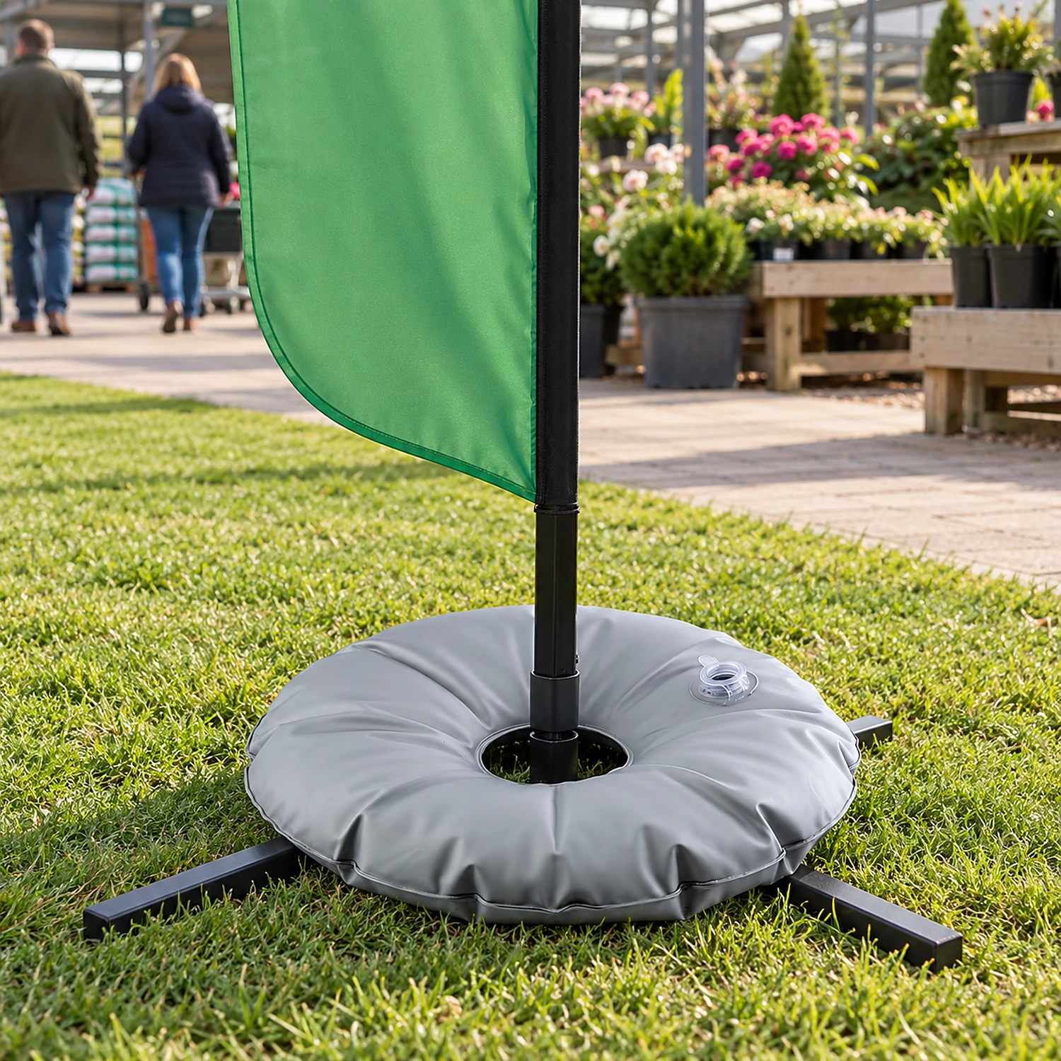 Water ring weight on a flag base outside a garden centre