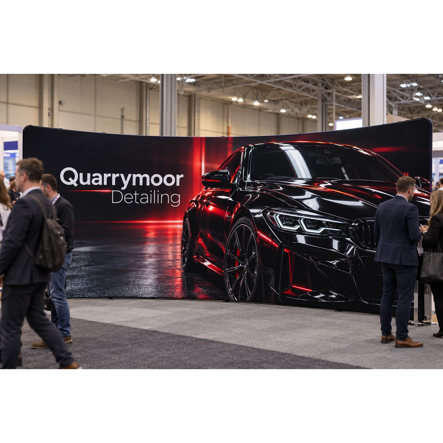 Wide curved fabric display wall in use at a busy trade show