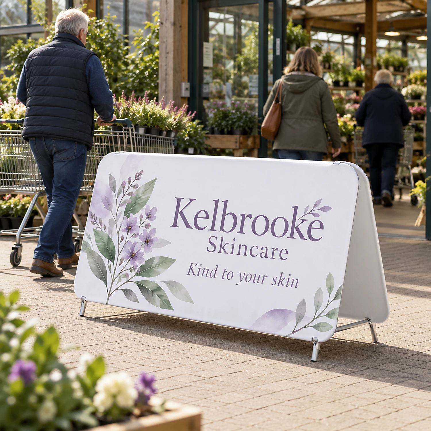 Double Stand Medium at a garden centre entrance, shown with an example design