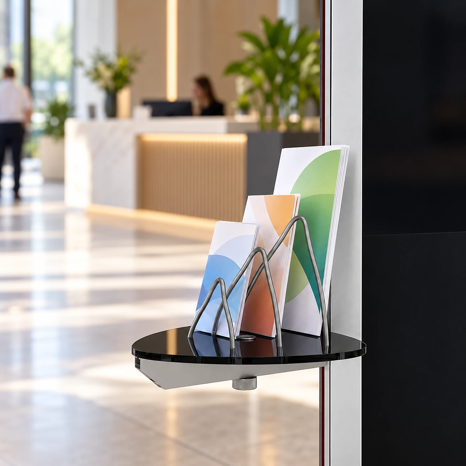 Black brochure holder on a kiosk in a reception area