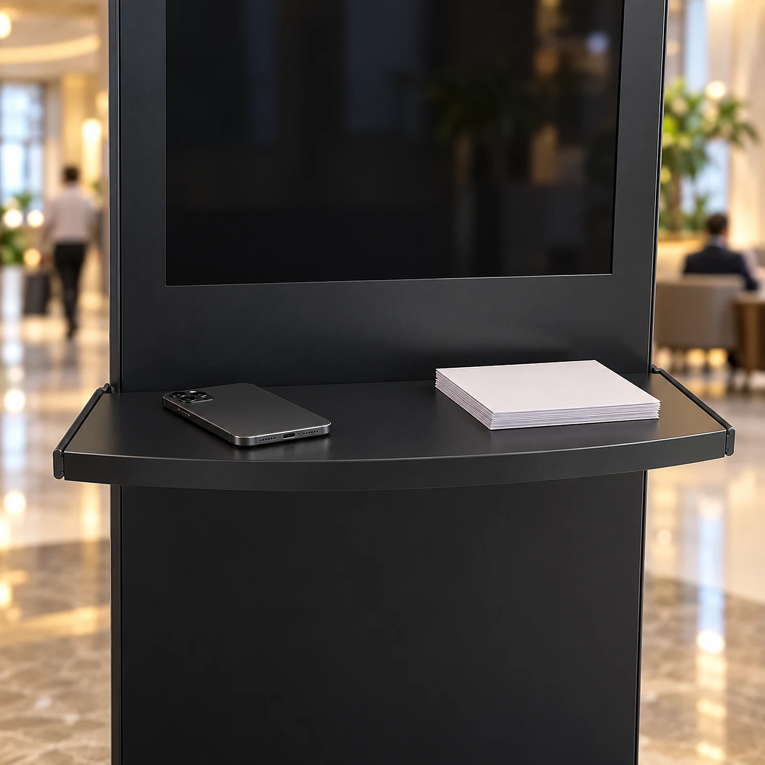 Black shelf with charger on a kiosk in a hotel lobby