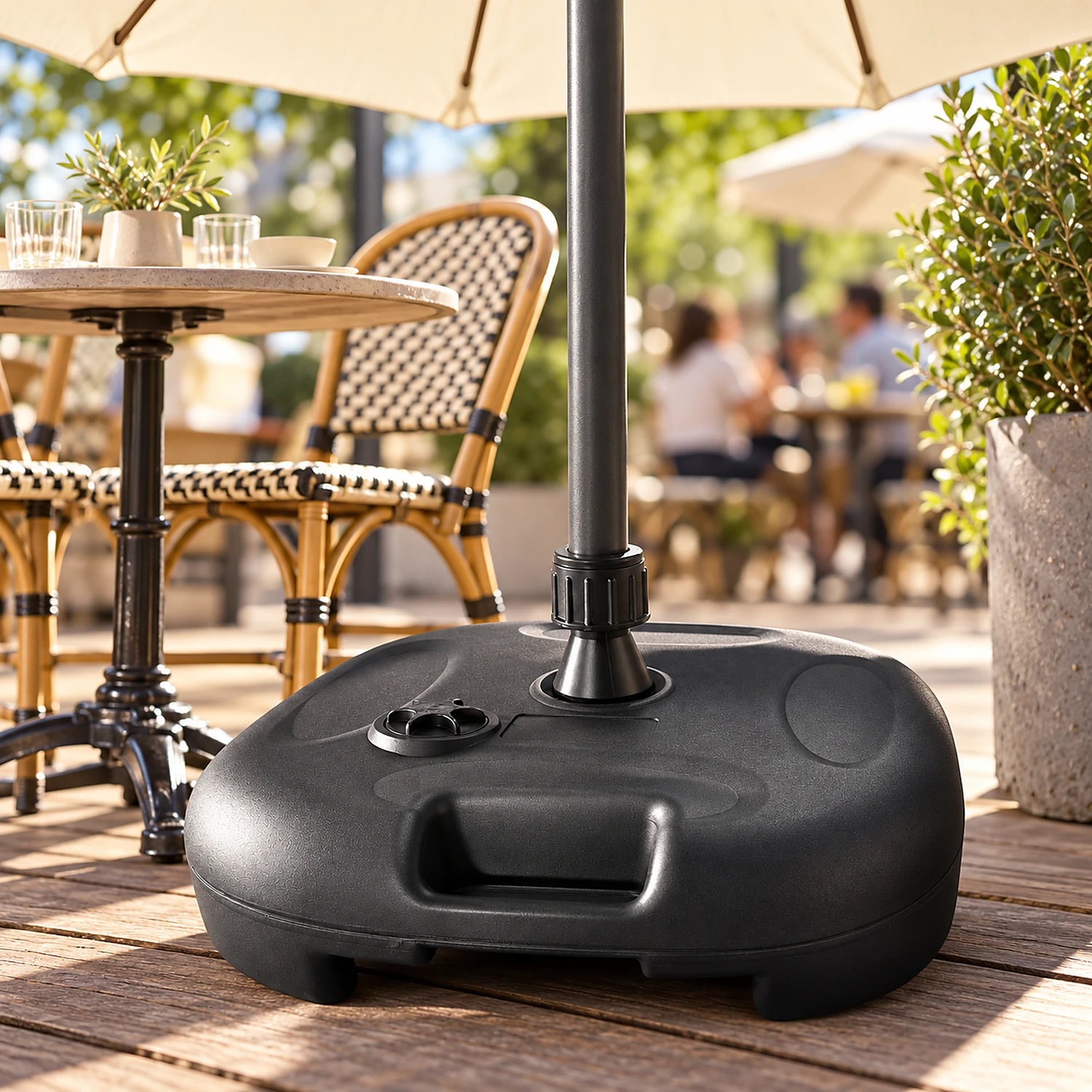 Water base holding a cream parasol on a cafe terrace