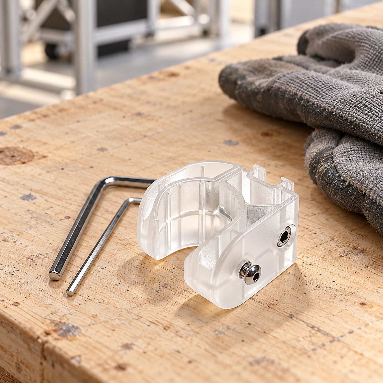 Spotlight tube clamp and hex keys on a workbench