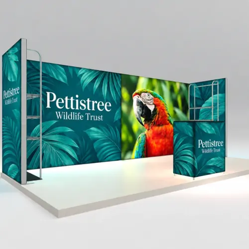 3m x 6m Exhibition Stand Kit with Counter, 6 Shelves & 4 Fabric Displays, shown with example artwork