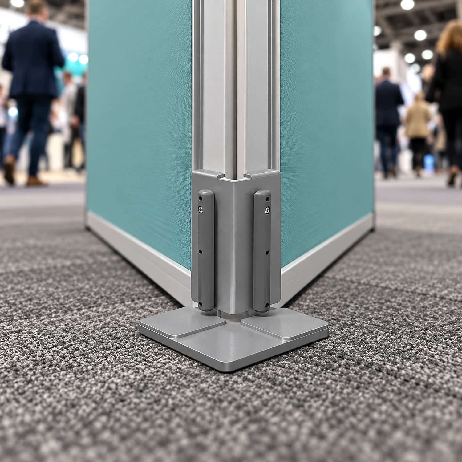 Bottom corner connector holding two fabric frames at a right-angle corner on a show floor