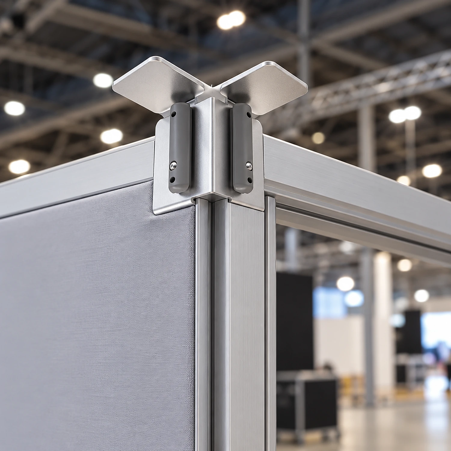 Corner connector joining two fabric frame uprights at a right-angle corner