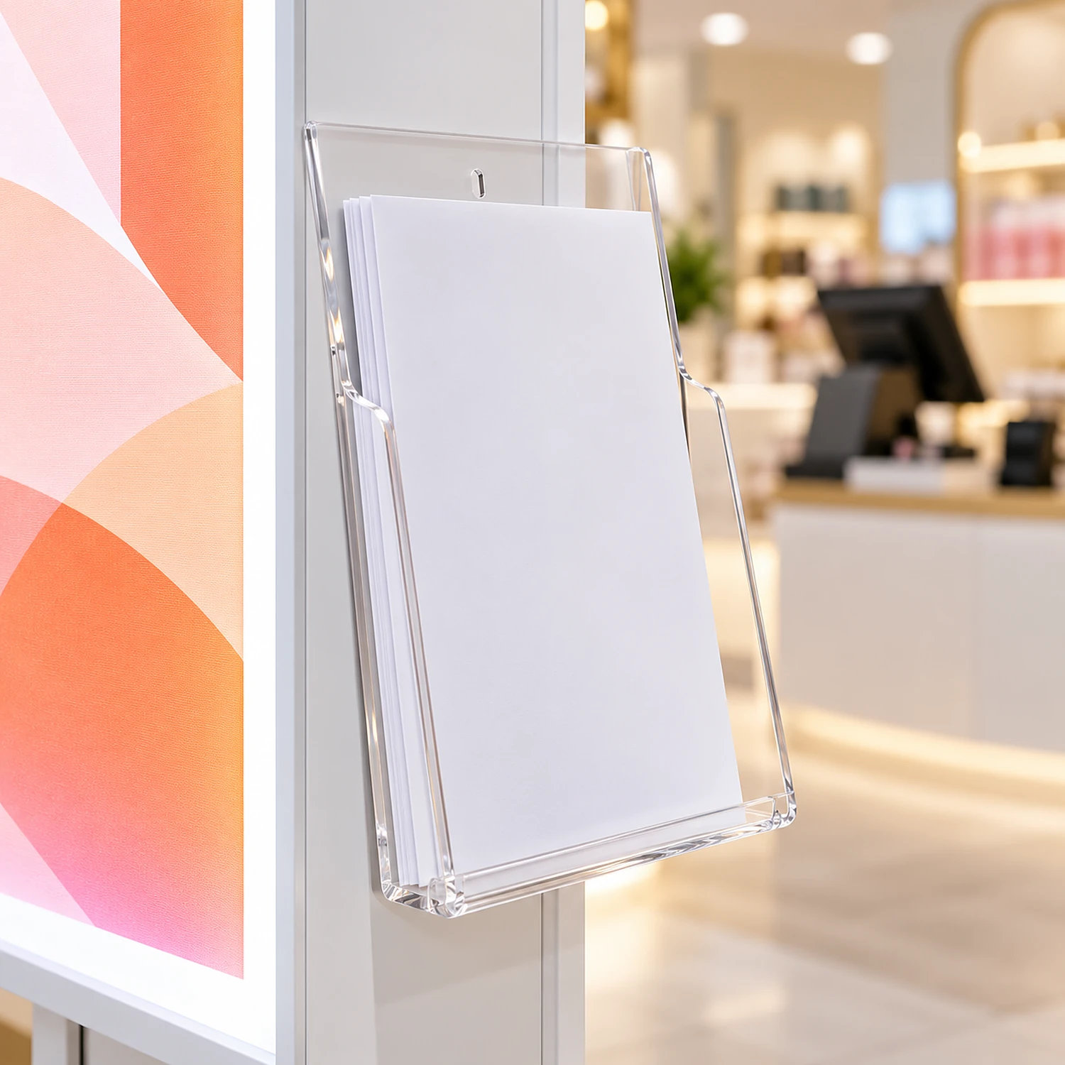 Clear A4 literature holder with leaflets on a lightbox frame in a shop
