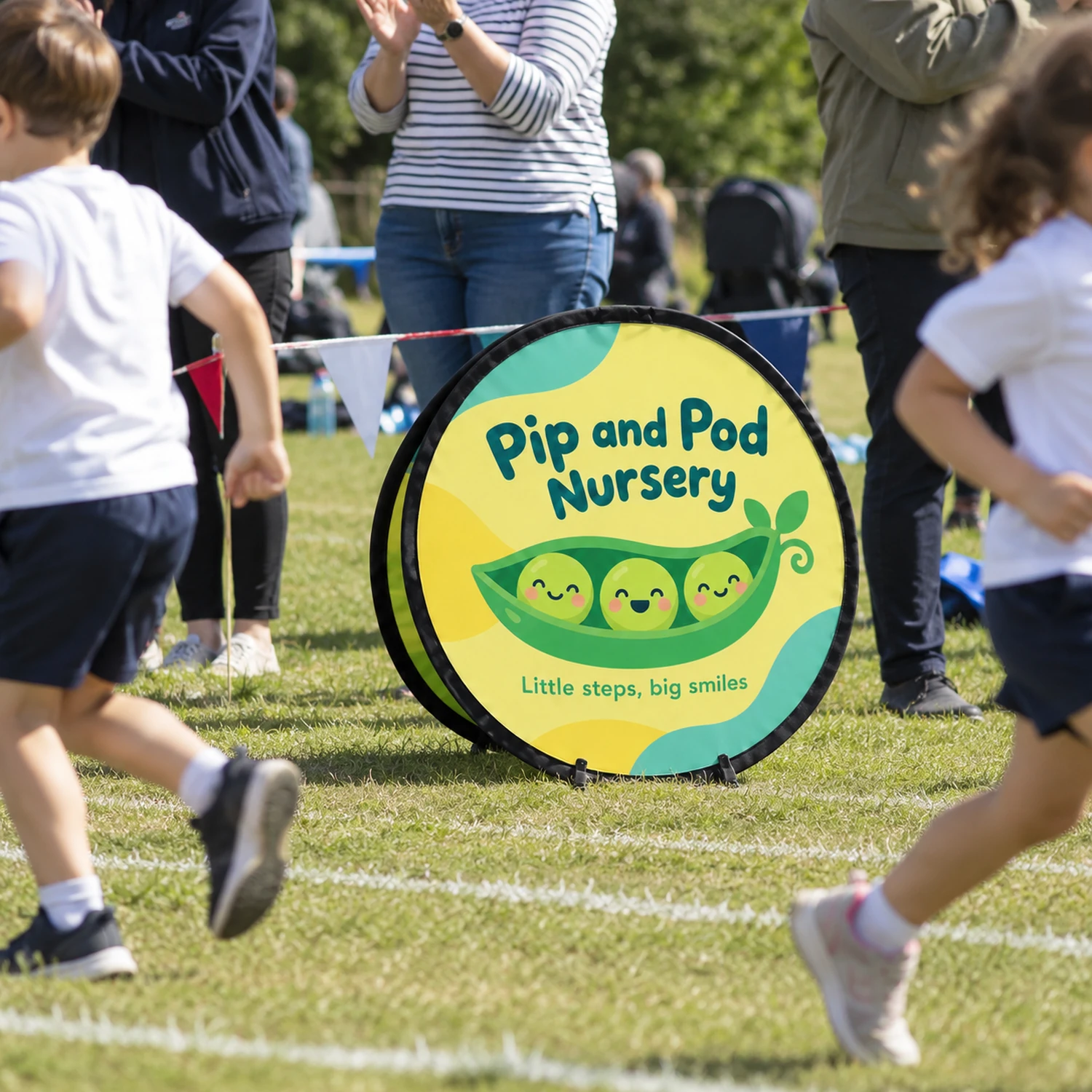 Circular Pop Out Banner 720mm Diameter, Flag Fabric in use at an event