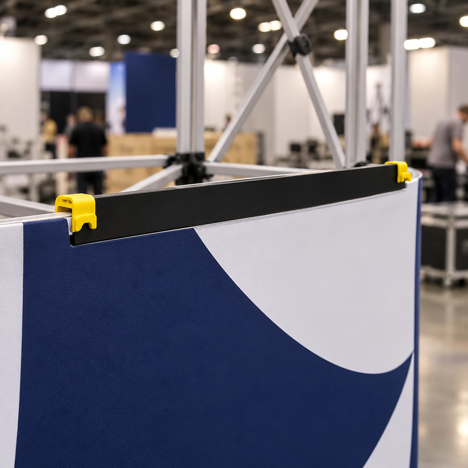 Curved end hanger along the top of a pop up graphic panel