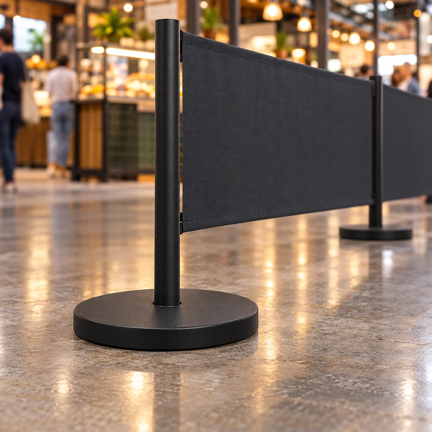 Black cafe barrier base forming a queue line at an indoor market