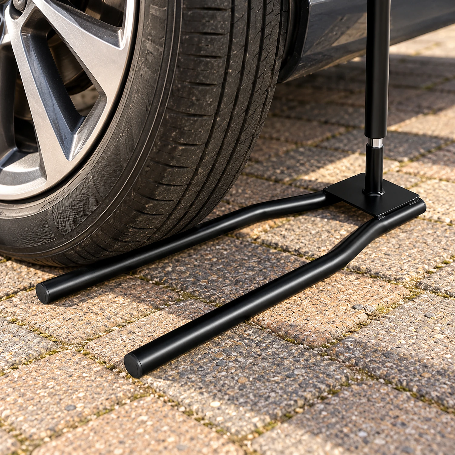 Car tyre resting on a flag car foot base