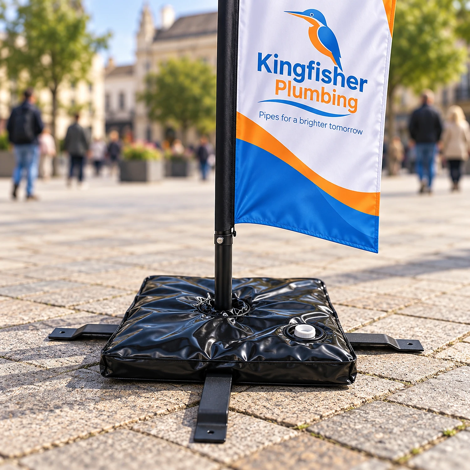 Large flag cross base with its weight bag holding a large feather flag