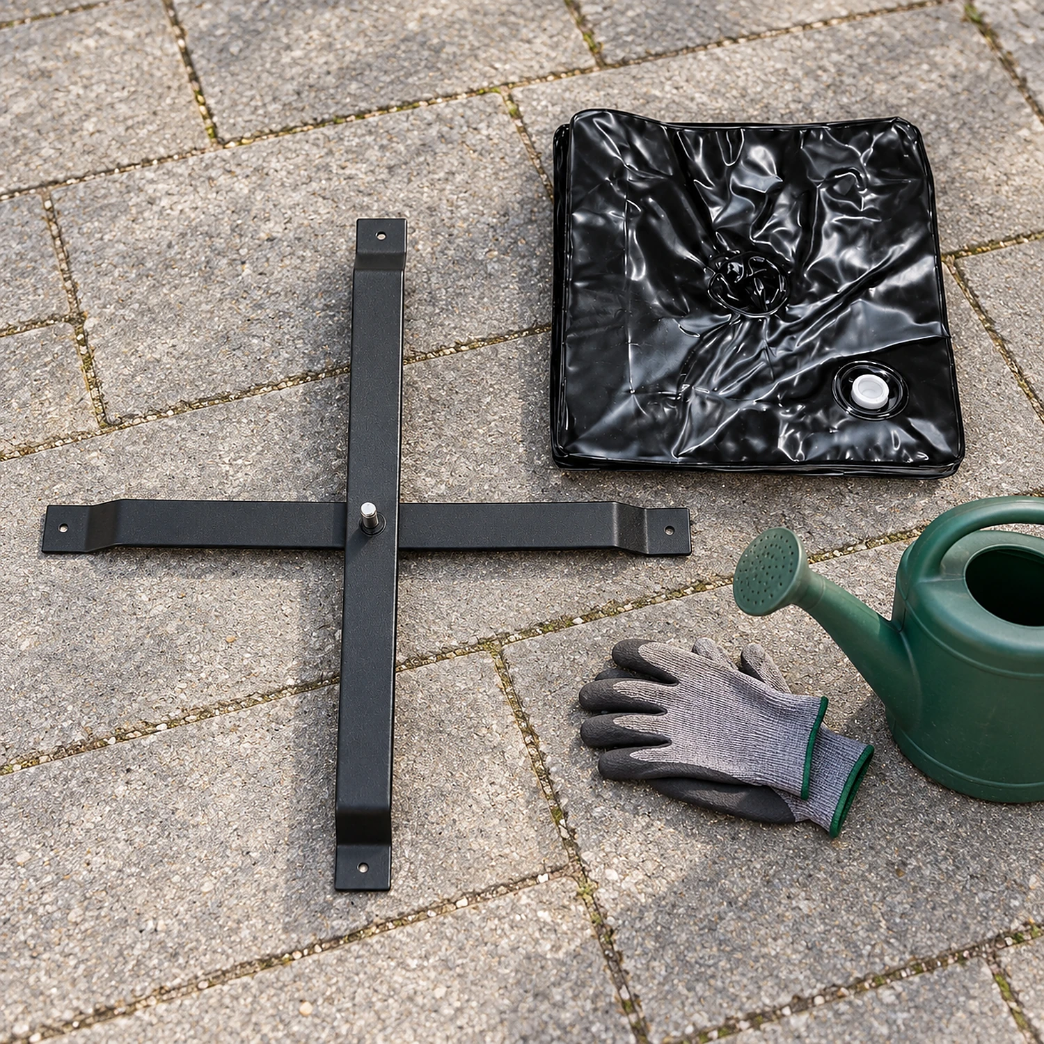 Large flag cross brace and weight bag laid out on paving before set-up